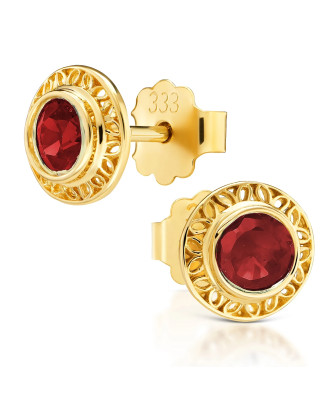 Lacy gold earrings with a red stone