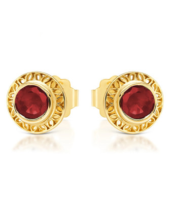 Lacy gold earrings with a red stone
