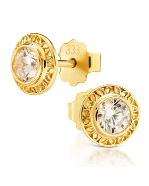 Lacy gold earrings with a white stone
