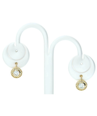 Lacy gold earrings with a white stone