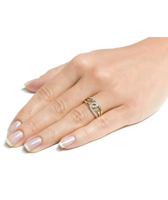 Wide gold ring interwoven with zircons