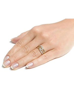 Wide gold ring interwoven with zircons