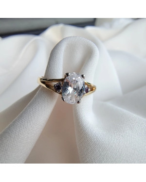 Gold ring with a large stone 8k purple zirconia