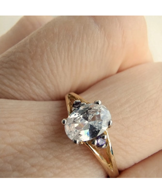 Gold ring with a large stone 8k purple zirconia