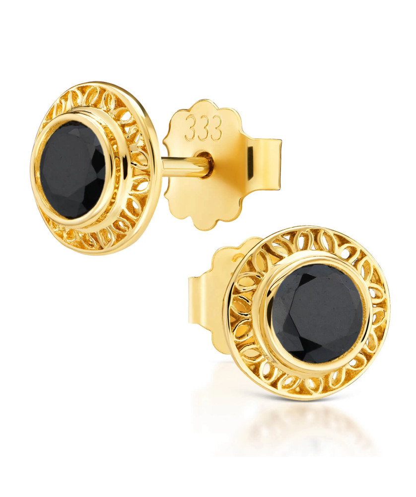 Lacy gold earrings with a black stone