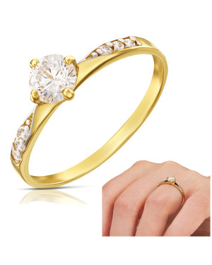 Gold engagement ring with a white stone