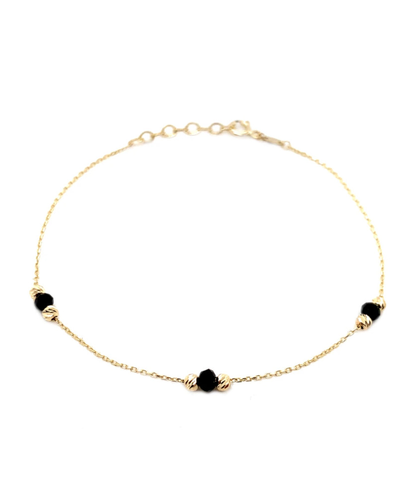 Bracelet with six golden diamond-cut beads and three black stones