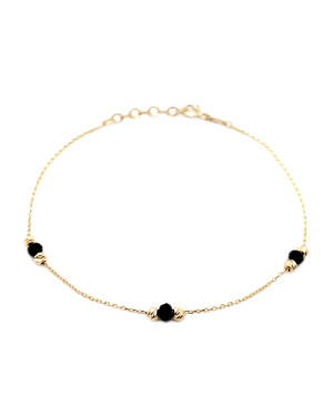 Bracelet with six golden diamond-cut beads and three black stones