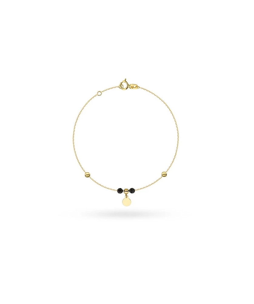 Gold bracelet with full circle and gold and black beads pendant