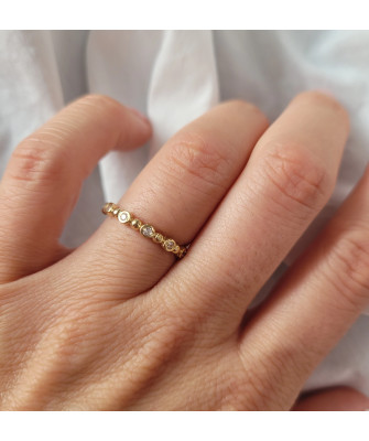 Thin golden ring white stones