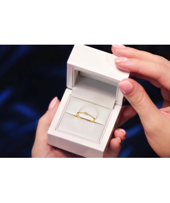 Delicate gold ring white stones