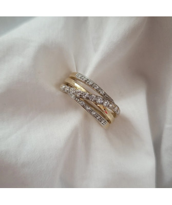 Wide gold ring with white stones