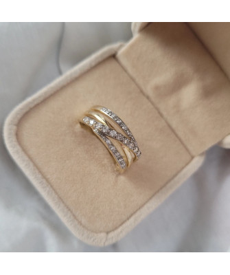 Wide gold ring with white stones