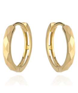 Gold diamond-cut hoop earrings on a creole