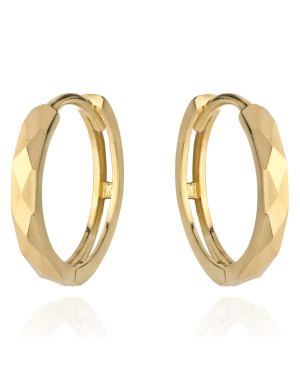 Gold diamond-cut hoop earrings on a creole