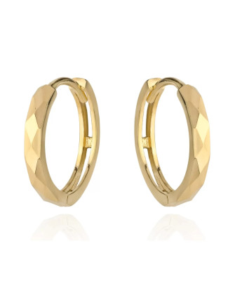 Gold diamond-cut hoop earrings on a creole