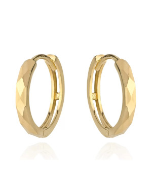 Gold diamond-cut hoop earrings on a creole
