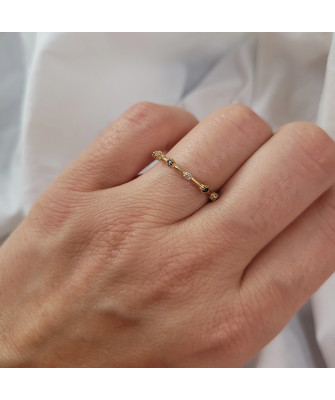 Gold ring with black and white zirconia