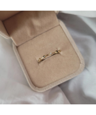 Gold ring with black and white zirconia