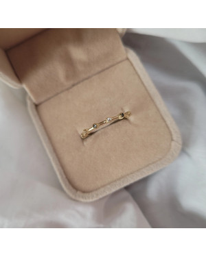 Gold ring with black and white zirconia