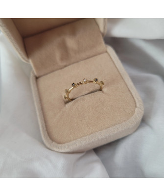 Gold ring with black and white zirconia