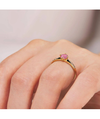 Gold engagement ring with pink stone