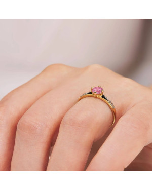 Gold engagement ring with pink stone