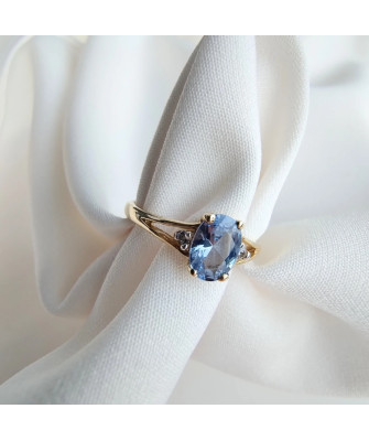 Gold ring with a blue marquise
