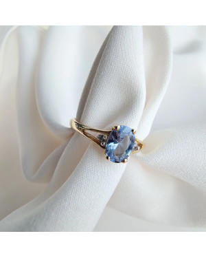 Gold ring with a blue marquise