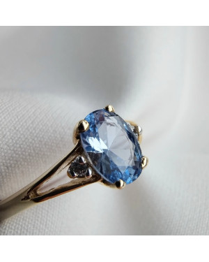 Gold ring with a blue marquise