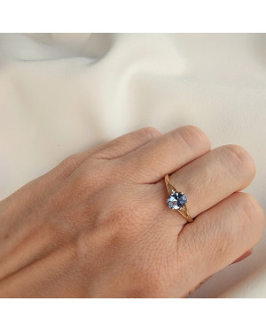 Gold ring with a blue marquise