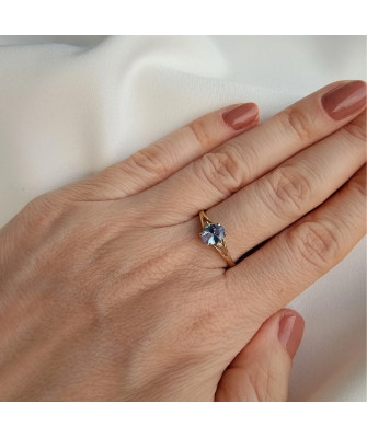 Gold ring with a blue marquise