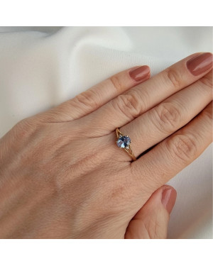 Gold ring with a blue marquise