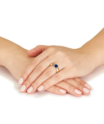 14k gold ring with a large sapphire stone