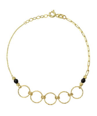 Gold diamond-cut rings and black stones bracelet