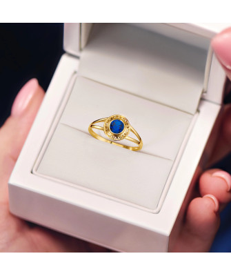 Gold filigree ring blue stone
