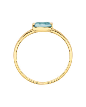 Delicate gold ring with a light blue stone