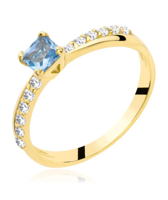Gold engagement ring blue stone