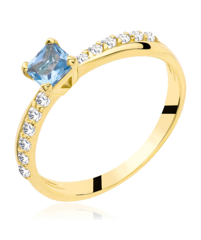 Gold engagement ring blue stone