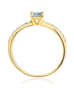 Gold engagement ring blue stone