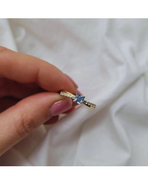 Gold engagement ring blue stone