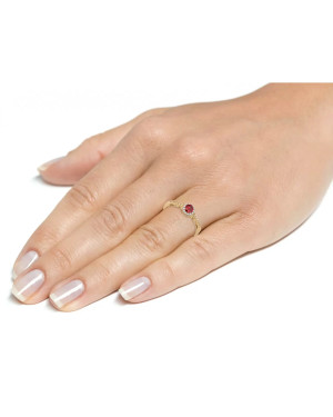 Engagement ring with a red stone