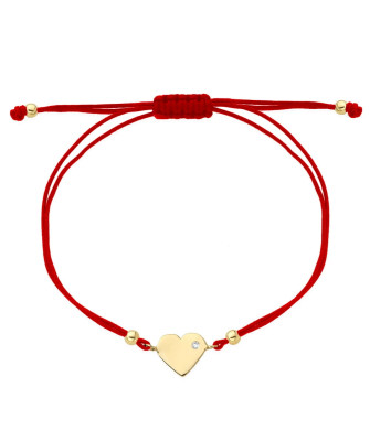 Gold heart bracelet with cubic zirconia on a red string