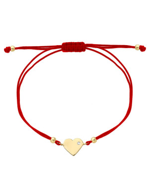 Gold heart bracelet with cubic zirconia on a red string