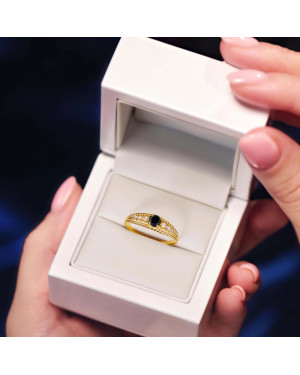 Gold ring with black stone