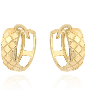 Gold earrings delicately decorated on a hoop