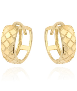 Gold earrings delicately decorated on a hoop
