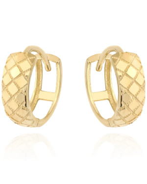 Gold earrings delicately decorated on a hoop