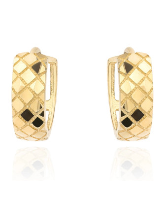 Gold earrings delicately decorated on a hoop