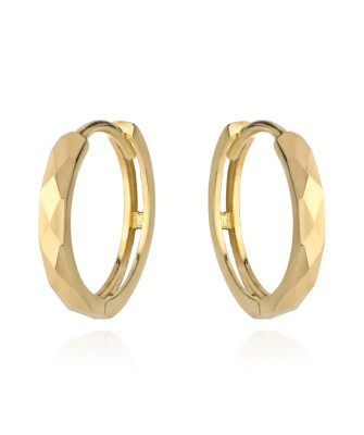 Gold diamond-cut hoop earrings on creole